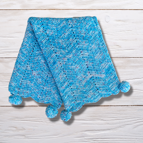 Pram blanket with pom poms - mixed blue, organic cotton